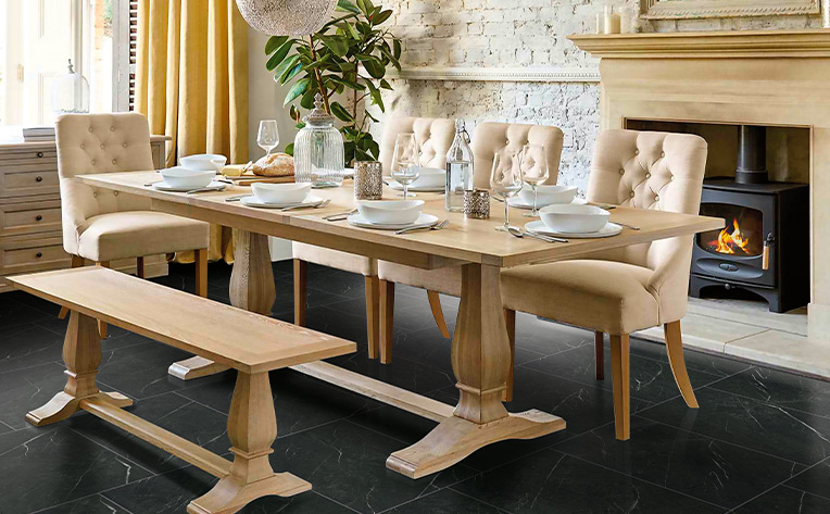 black marble tile in dining room with fireplace